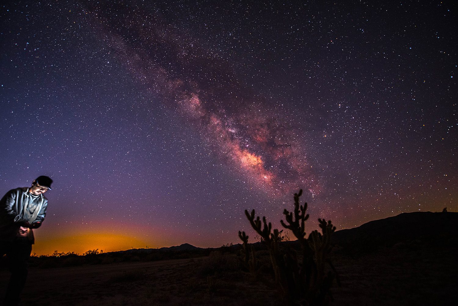 Man, lights, stars. Landscape photograph by Mike Florendo, finalist in the Shoot The Frame Landscape photography award, March 2015