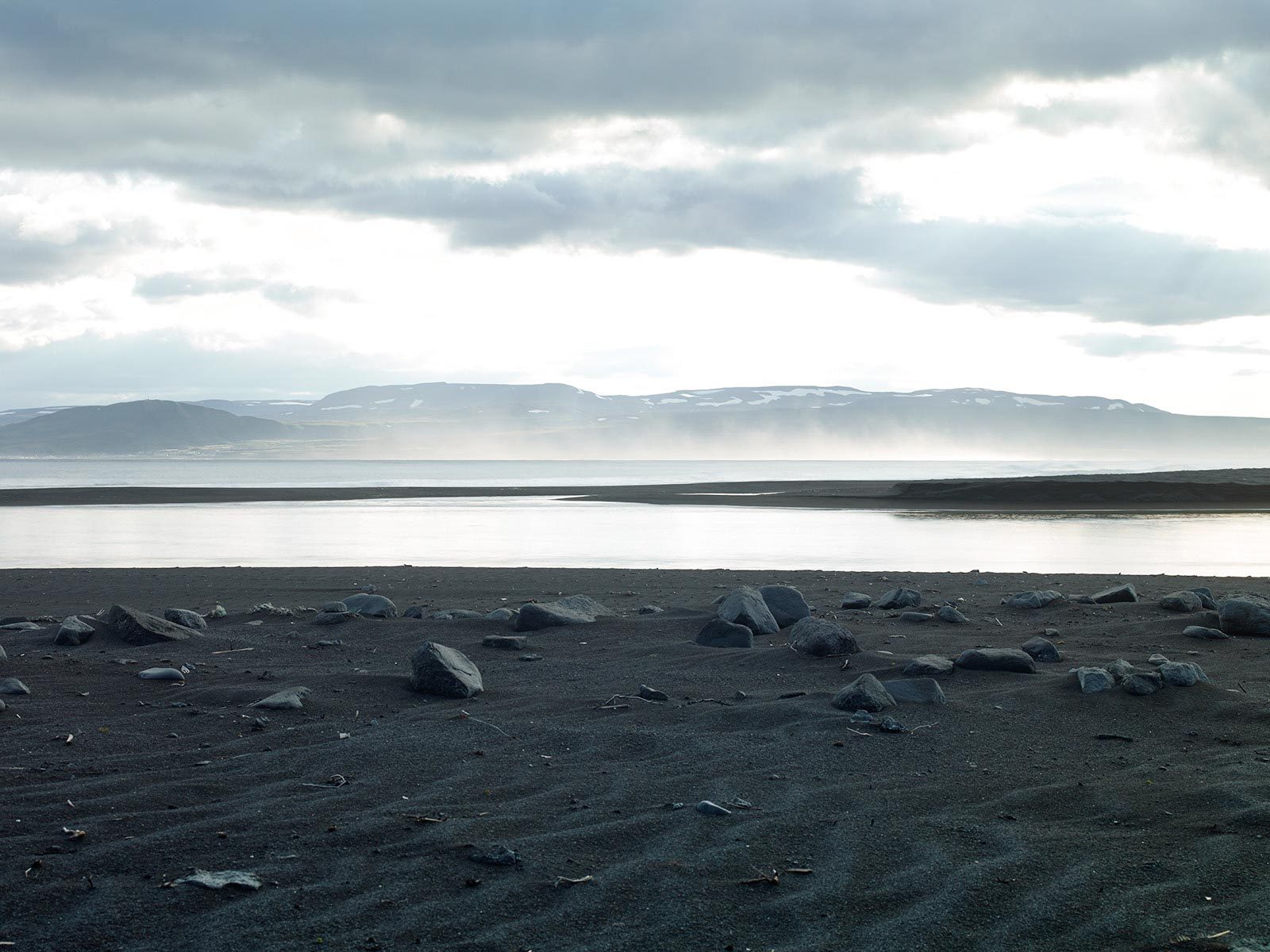 Mountains, water, stones, sand. Landscape photograph by Guillaume Fandel, finalist in the Shoot The Frame Landscape photography award, May 2016