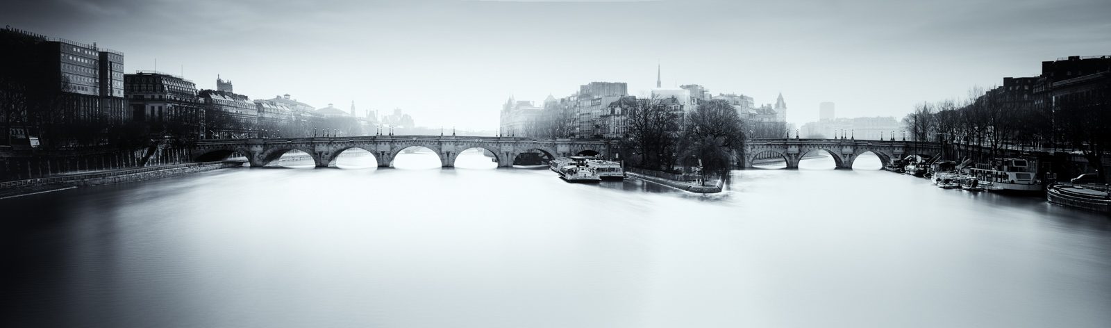 Bridge, buildings, river, boat. Landscape photograph by Paul Sanders, finalist in the Shoot The Frame Landscape photography award, May 2016