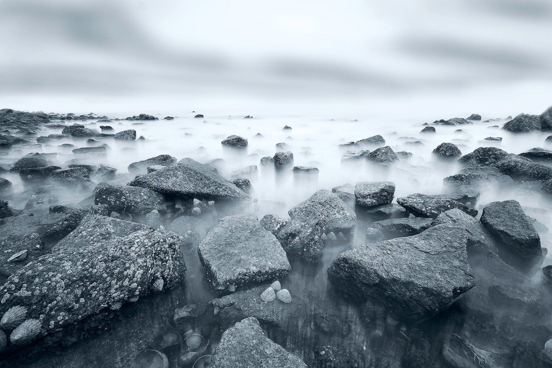 Rocks, water, sky. Landscape photograph by Valentin Boitel-Denyset, winner of the Shoot The Frame Landscape photography award, February 2018