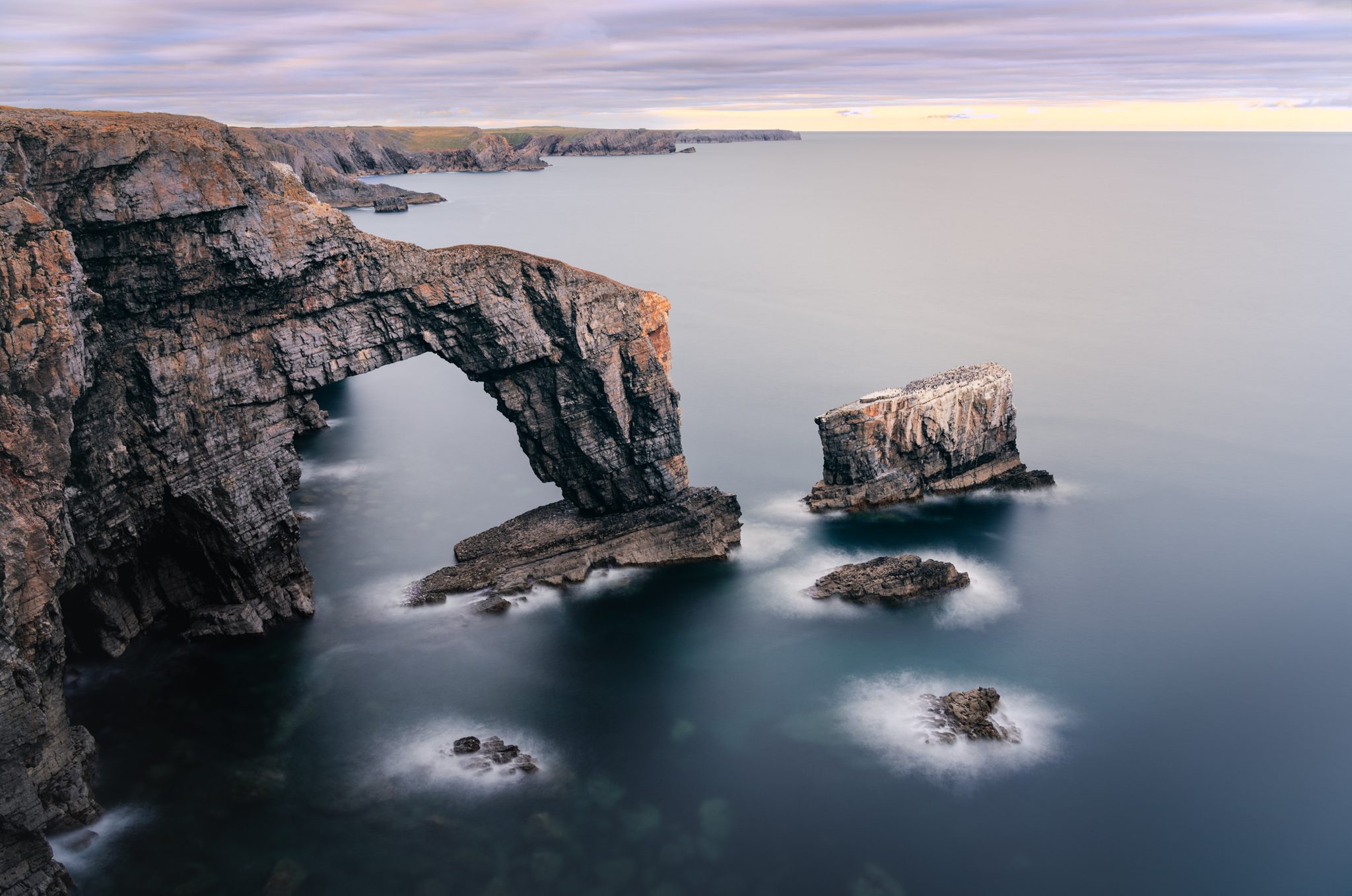 Pembrokeshire's Arch, Castlemartin, Pembroke SA71, UK. Landscape photograph by Tim Burgess, finalist in the Shoot The Frame Landscape photography award, April 2023