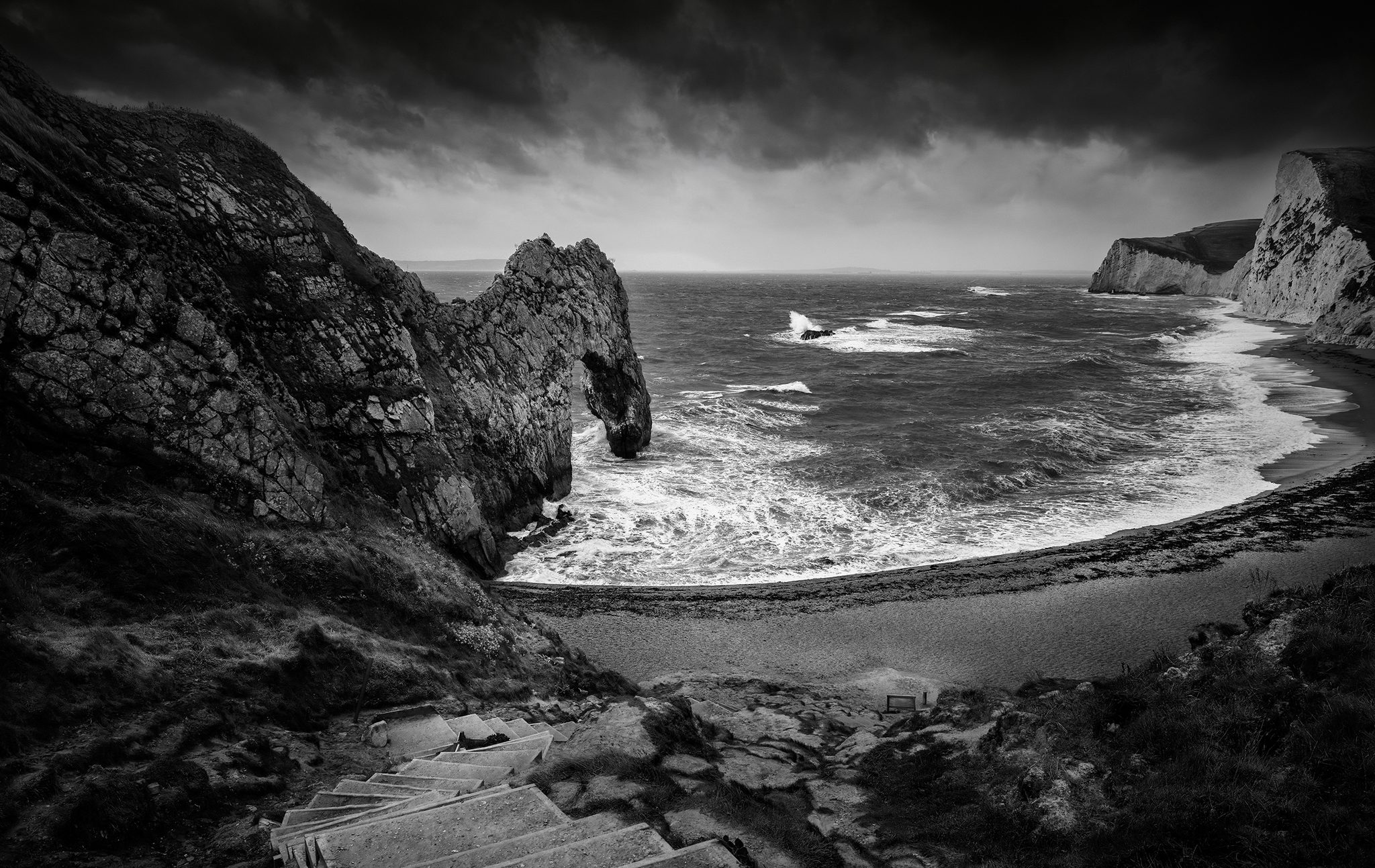 Stormy start at Durdle Door, Durdle Door, Littledown, Wareham BH20 5PU, UK. Landscape photograph by Tim Burgess, finalist in the Shoot The Frame Landscape photography award, November 2023